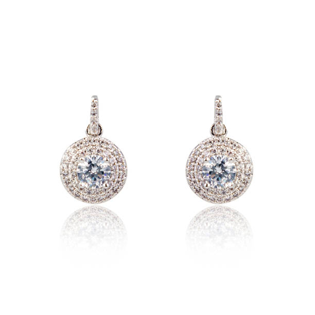 Pair of silver diamond earrings isolated on white background