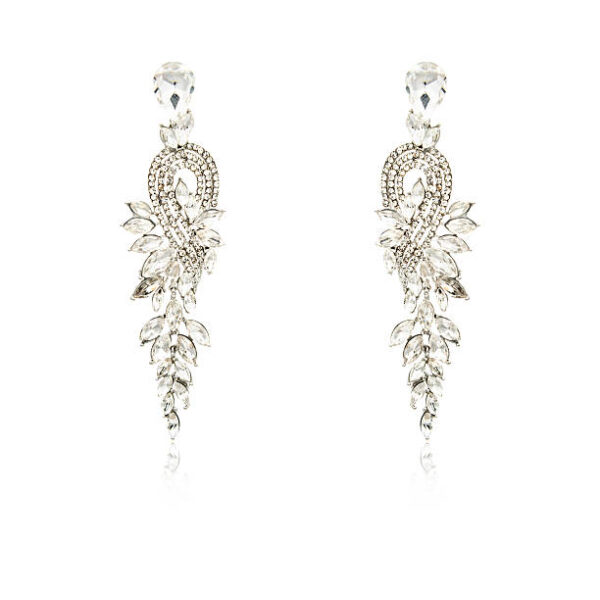 Pair of silver diamond earrings isolated on white background