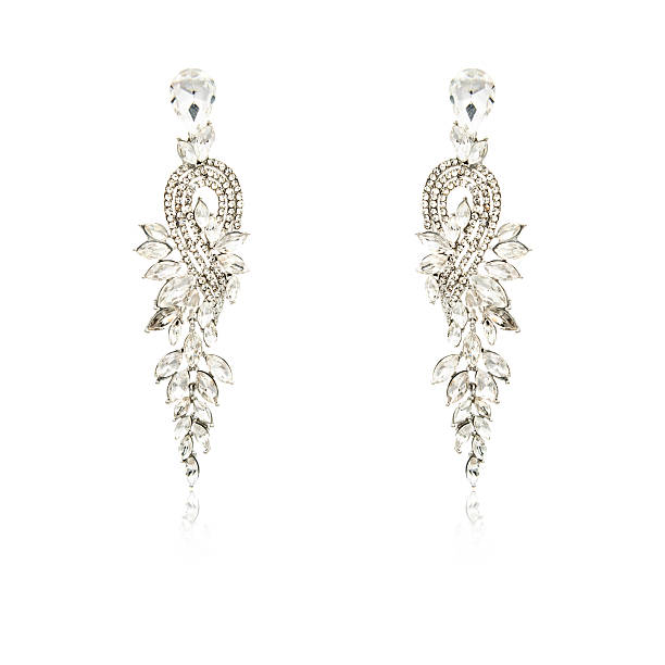 Pair of silver diamond earrings isolated on white background